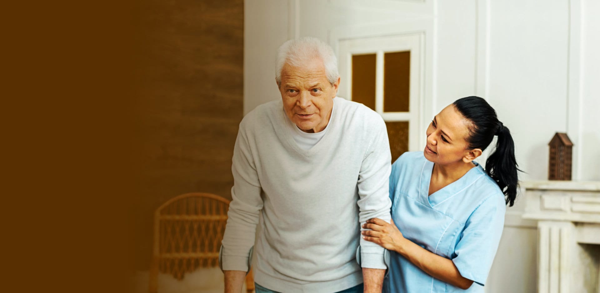 portrait of caregiver helping senior man