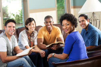 a group of people having a bible study